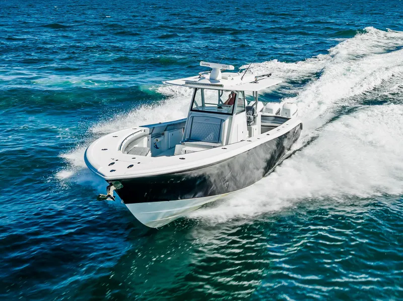 Slide: The Image of 2021 Yellowfin 39 boat cruising on open blue water. - 18