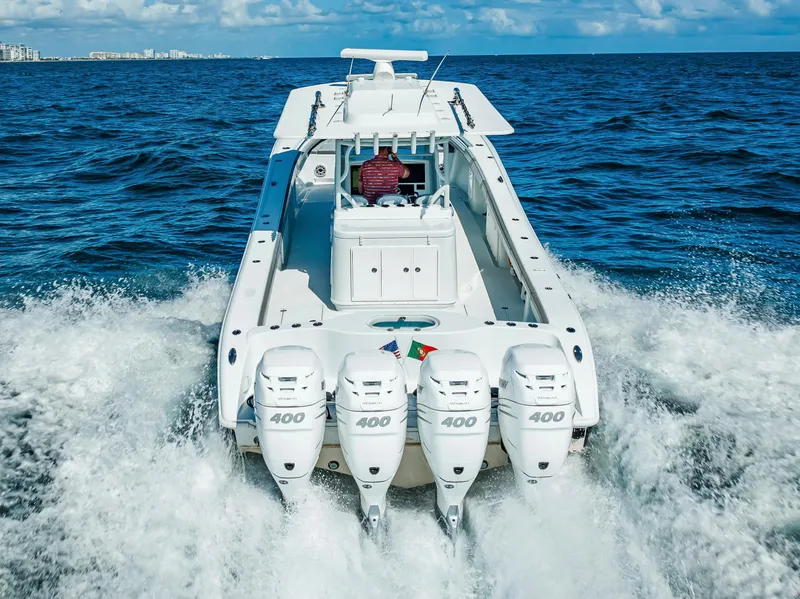 Slide: The Image of 2021 Yellowfin 39 boat with four powerful engines cruising on open water. - 19