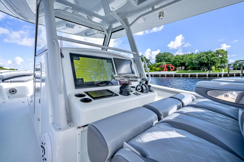 Slide: The Image of 2021 Yellowfin 39 boat interior with navigation system and luxurious seating. - 23