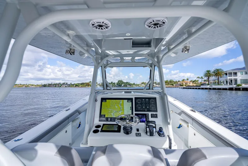 Slide: The Image of 2021 Yellowfin 39 boat cockpit with advanced navigation system on a sunny day. - 24
