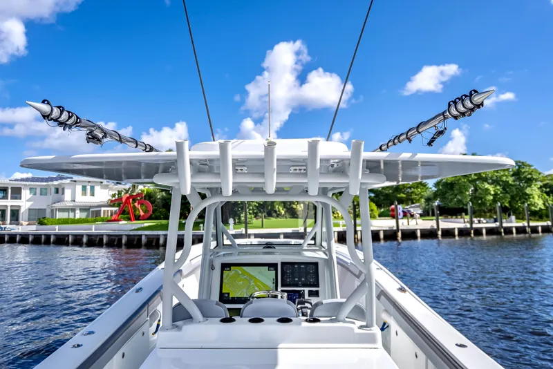 Slide: The Image of 2021 Yellowfin 39 boat on water, clear sky, modern navigation system. - 26