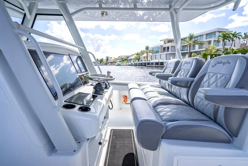 Slide: The Image of 2021 Yellowfin 39 boat interior with luxurious seating and modern controls. - 27