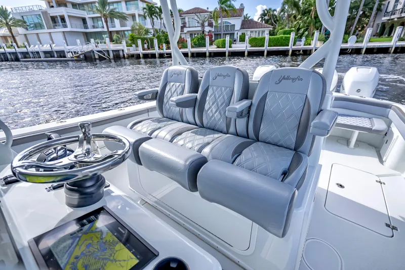 Slide: The Image of 2021 Yellowfin 39 boat interior with luxury seating and modern navigation system. - 29