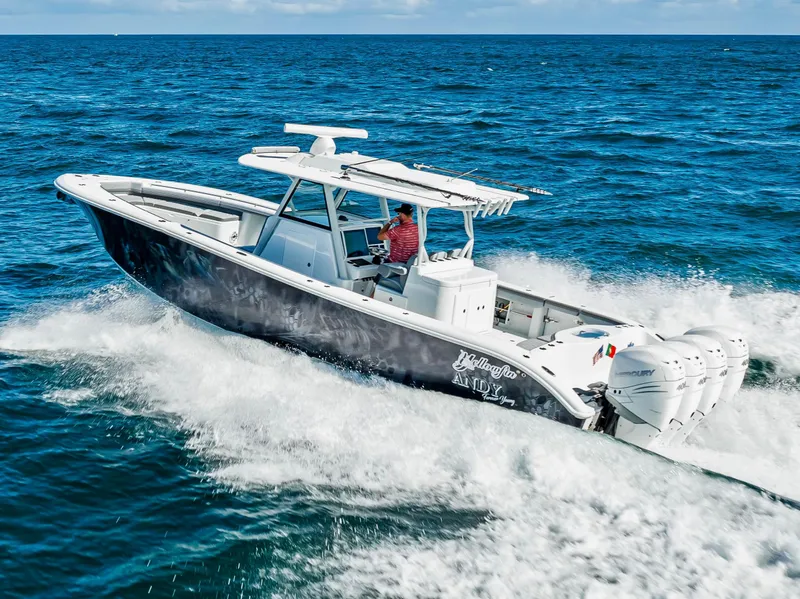 Slide: The Image of 2021 Yellowfin 39 boat cruising on open ocean waters. - 4