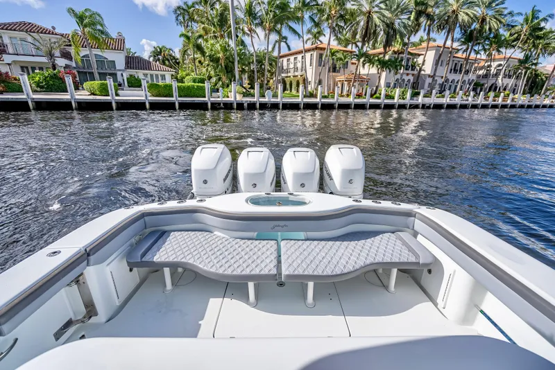Slide: The Image of 2021 Yellowfin 39 boat with quad engines on a scenic waterfront. - 44