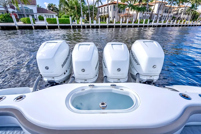 Slide: The Image of 2021 Yellowfin 39 boat with four Mercury outboard engines on a waterfront. - 45