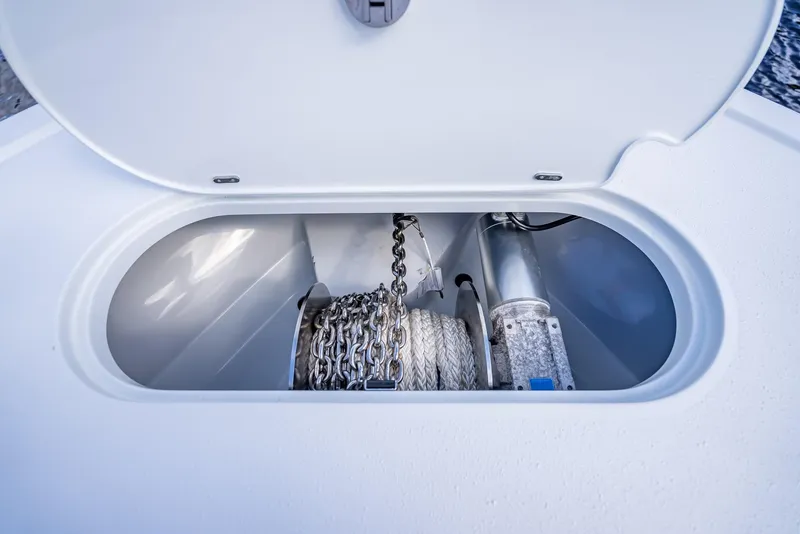 Slide: The Image of Anchor storage compartment on 2021 Yellowfin 39 boat, featuring chain and rope. - 49