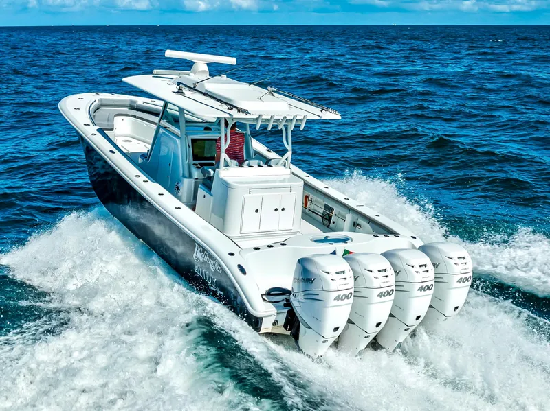 Slide: The Image of 2021 Yellowfin 39 boat cruising on open ocean with four powerful engines. - 5