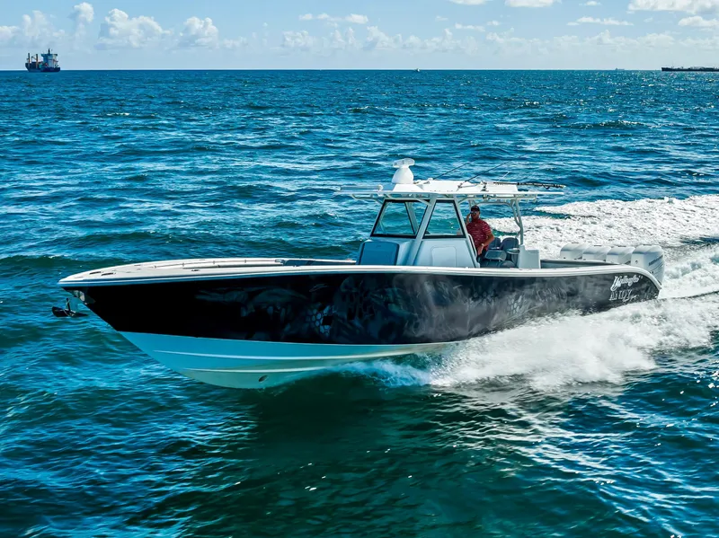 Slide: The Image of 2021 Yellowfin 39 boat cruising on open ocean waters. - 7