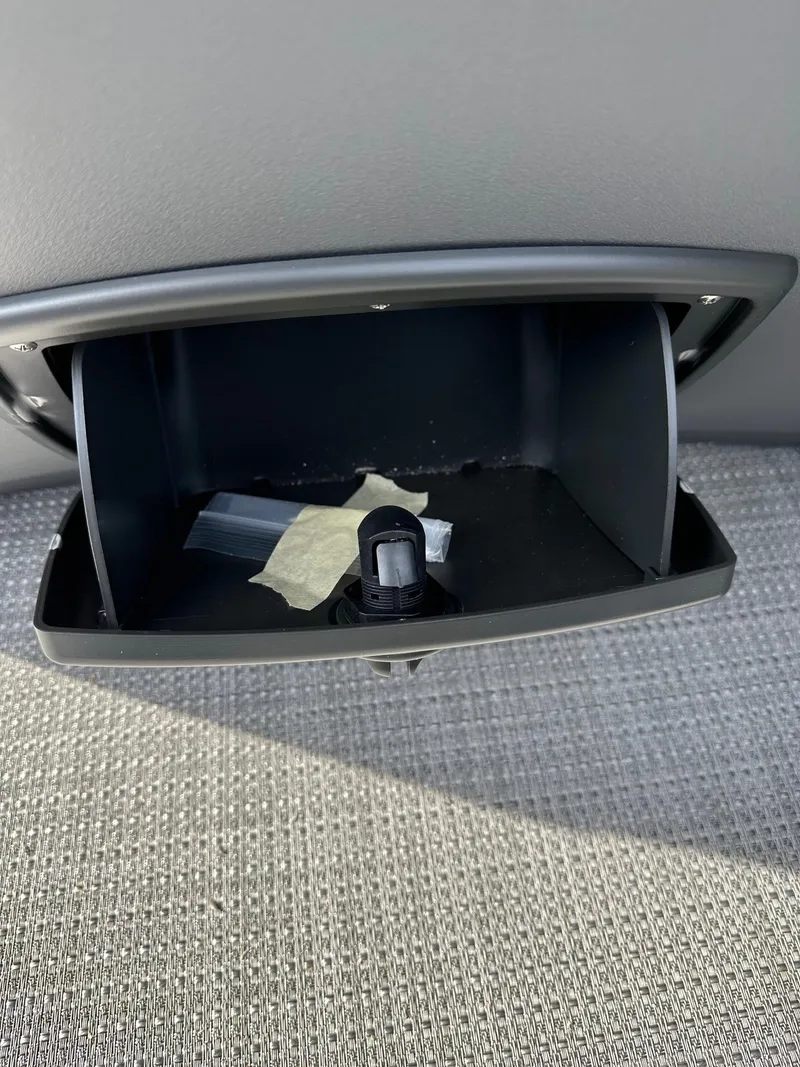 Slide: The Image of Open storage compartment in 2024 Bennington 20 SSR Quad Bench pontoon boat. - 11