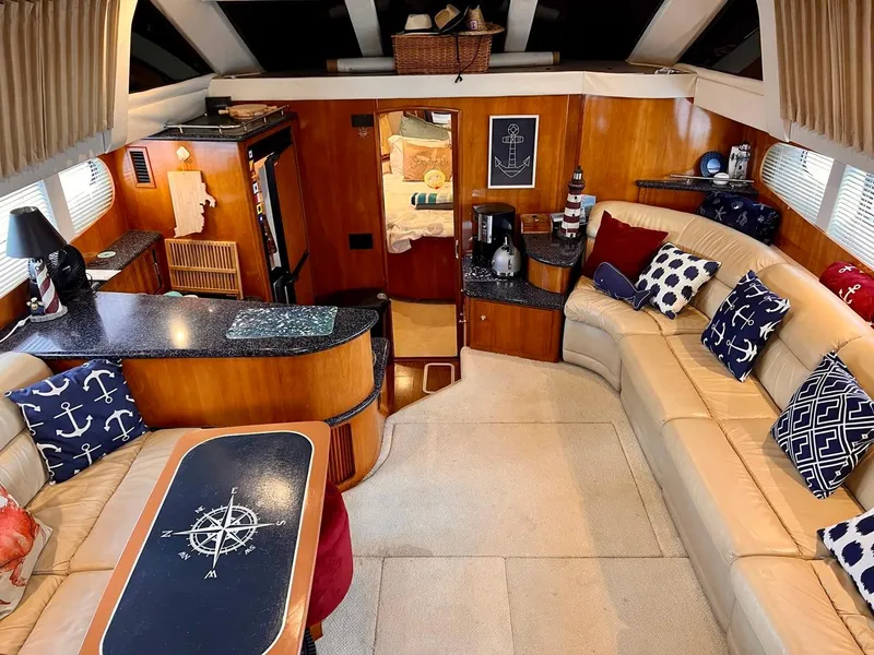 Slide: The Image of Interior of 2000 Carver 396 Motor Yacht with nautical-themed decor. - 15