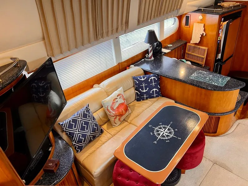 Slide: The Image of Interior of 2000 Carver 396 Motor Yacht with nautical-themed decor. - 16