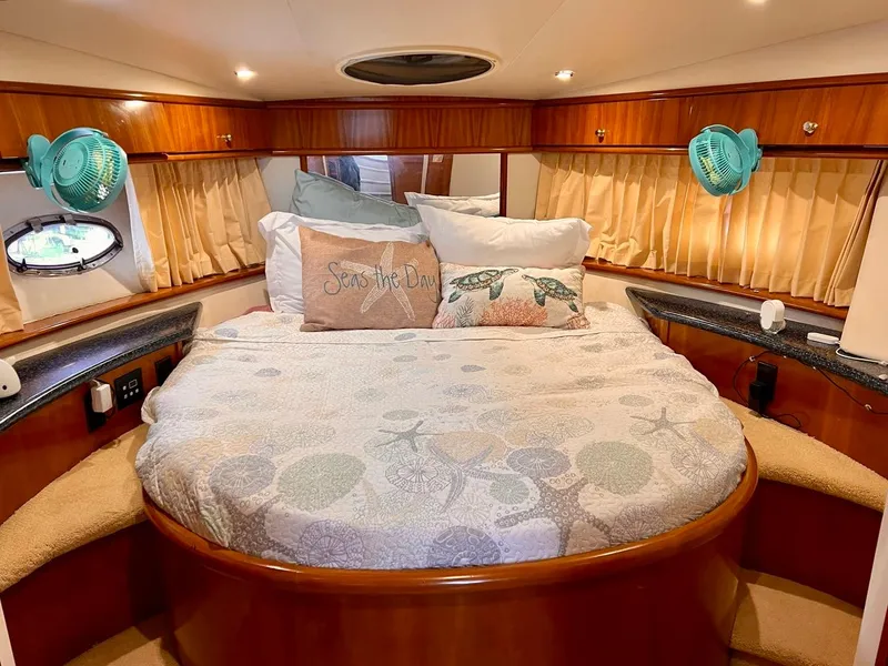 Slide: The Image of Cozy bedroom in a 2000 Carver 396 Motor Yacht with nautical decor. - 22