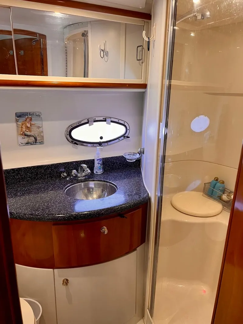 Slide: The Image of 2000 Carver 396 Motor Yacht bathroom with sink and shower. - 31