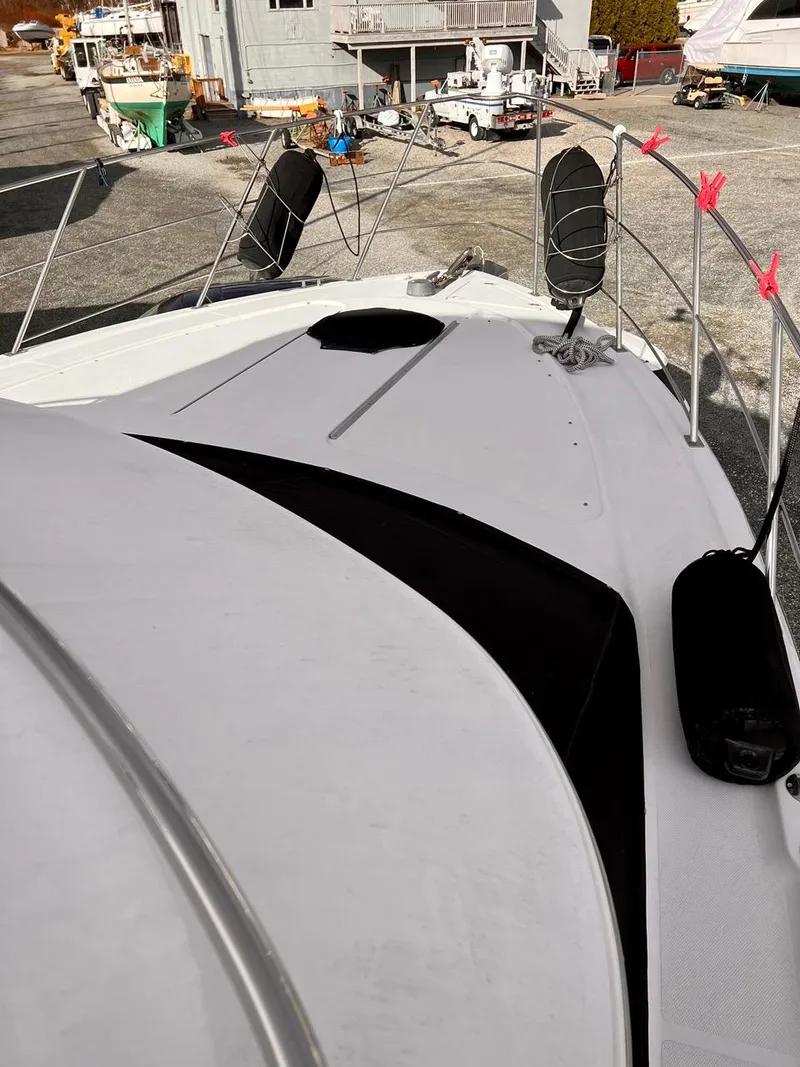 Slide: The Image of 2000 Carver 396 Motor Yacht bow view in a marina. - 4