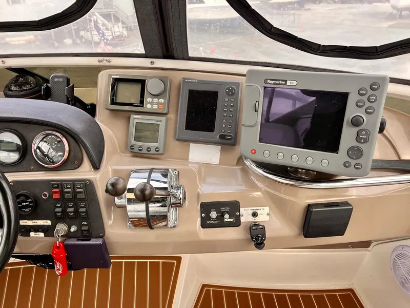 Slide: The Image of Control panel of a 2000 Carver 396 Motor Yacht with navigation equipment. - 9