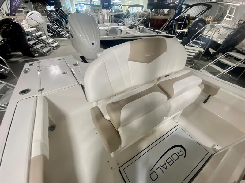 Slide: The Image of 2026 Robalo 246 Cayman boat interior with seating and deck details. - 15