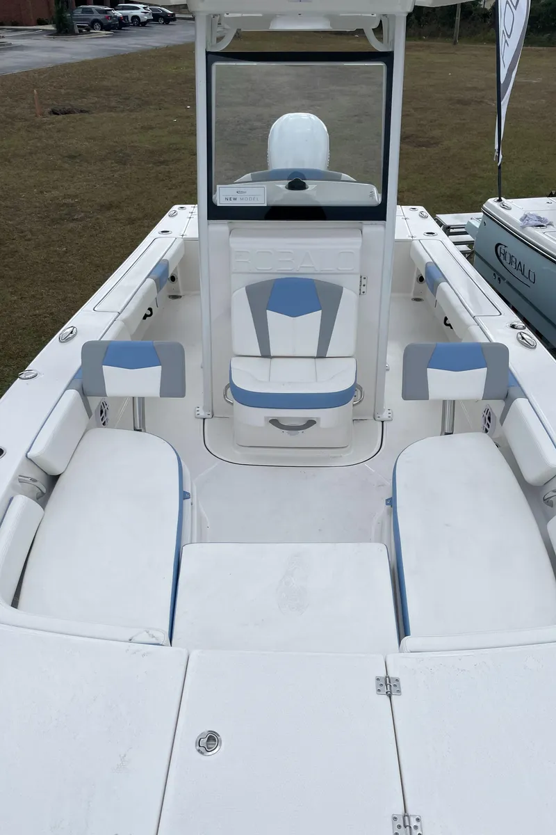 Slide: The Image of 2026 Robalo 246 Cayman boat interior with seating and console, showcasing modern design. - 12