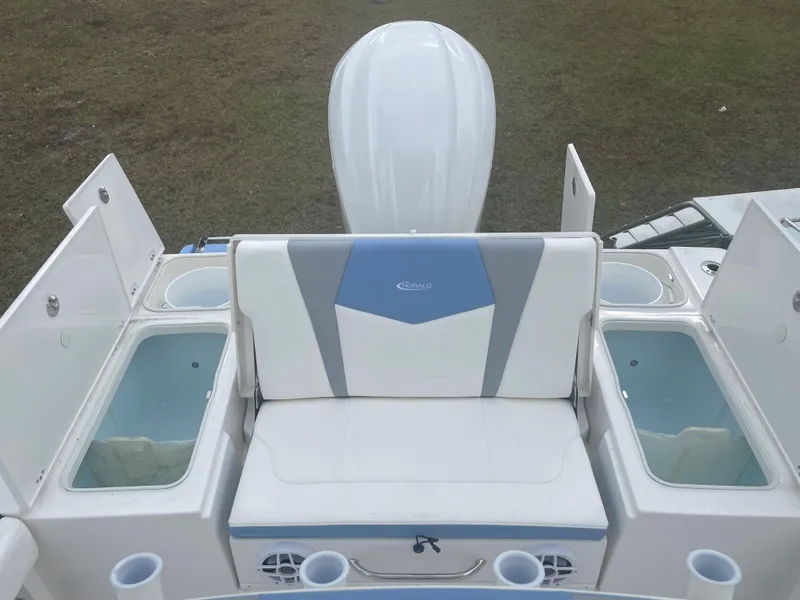 Slide: The Image of 2026 Robalo 246 Cayman boat interior with seating and storage compartments. - 4