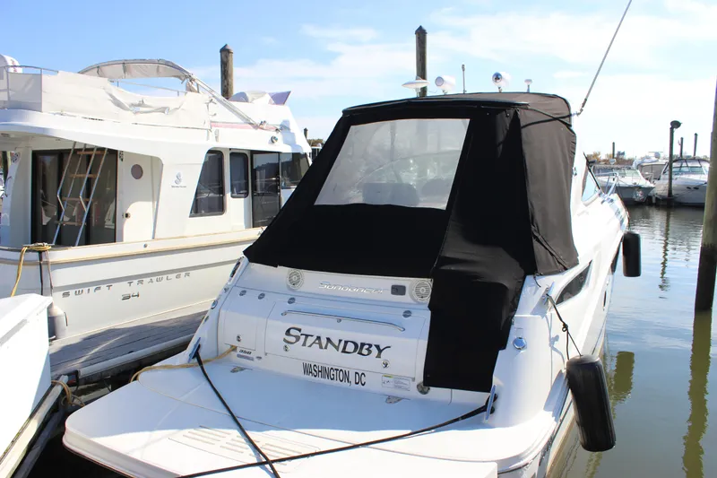 The Image of 2014 Sea Ray 350 Sundancer docked at marina, rear view. - 0