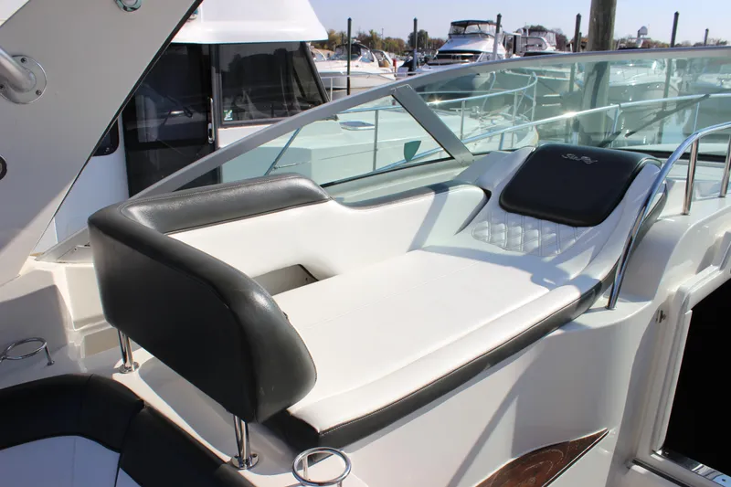 Slide: The Image of 2014 Sea Ray 350 Sundancer boat with sleek seating and glass railing. - 15