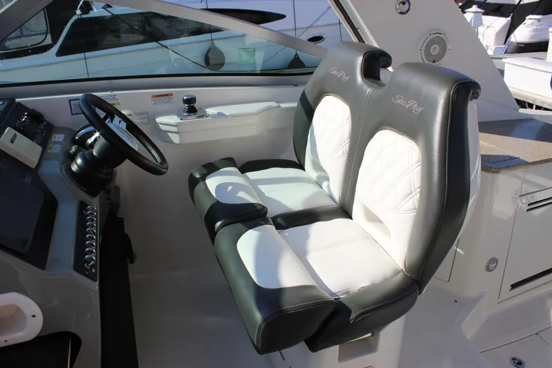 Slide: The Image of Interior helm seating of 2014 Sea Ray 350 Sundancer boat. - 17