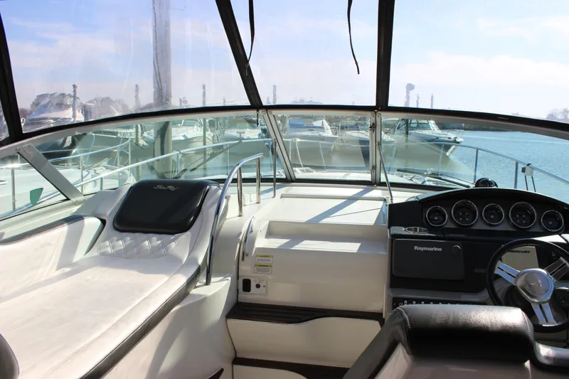 Slide: The Image of Interior view of 2014 Sea Ray 350 Sundancer yacht cockpit with steering wheel and dashboard. - 32