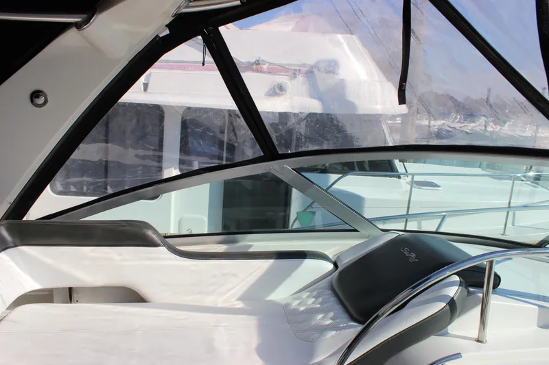 Slide: The Image of Interior view of 2014 Sea Ray 350 Sundancer yacht with sleek seating and windows. - 39