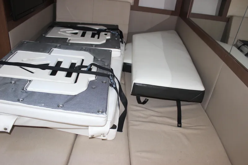 Slide: The Image of Interior seating of 2014 Sea Ray 350 Sundancer boat with cushions and straps. - 44