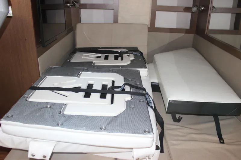 Slide: The Image of Interior cabin of 2014 Sea Ray 350 Sundancer with seating and cushions. - 45