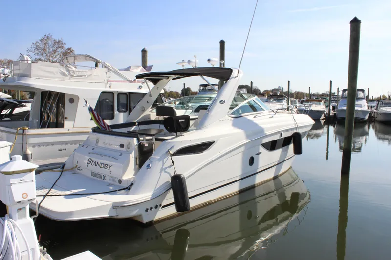 Slide: The Image of 2014 Sea Ray 350 Sundancer yacht docked in marina, side view. - 5