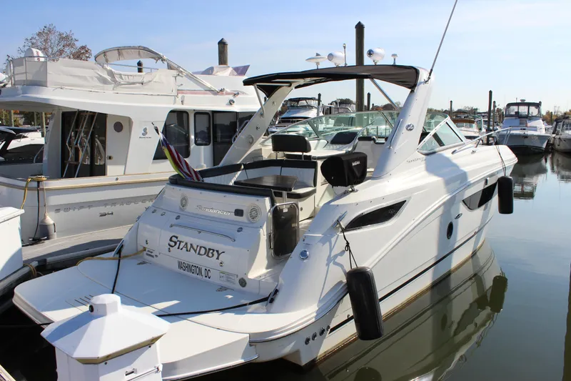 Slide: The Image of 2014 Sea Ray 350 Sundancer yacht docked in marina, rear view. - 6