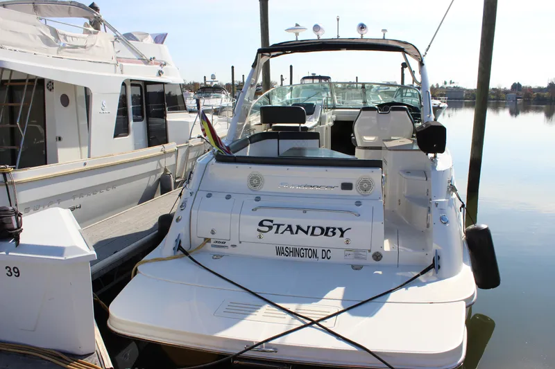 Slide: The Image of 2014 Sea Ray 350 Sundancer docked, rear view, named "Standby," Washington, DC. - 7