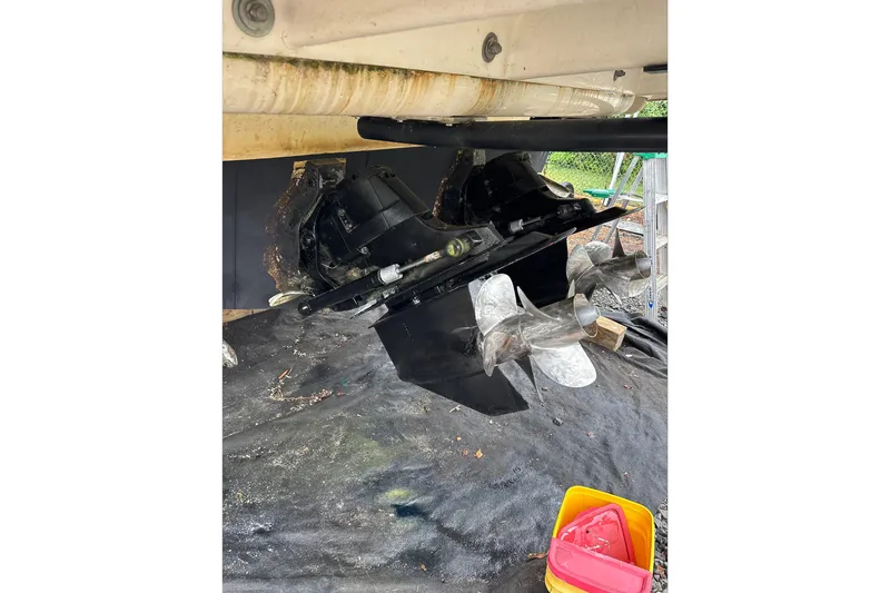 Slide: The Image of 2014 Sea Ray 350 Sundancer boat propellers and stern drive, maintenance view. - 75