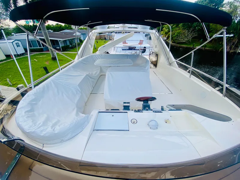 Slide: The Image of 2006 Viking Sport Cruisers 70 Motor Yacht with spacious deck and seating area. - 23