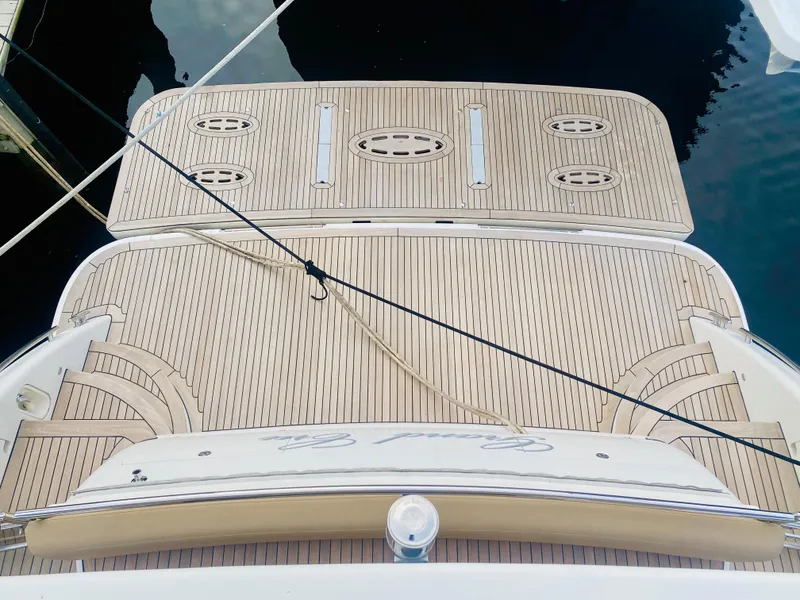 Slide: The Image of 2006 Viking Sport Cruisers 70 Motor Yacht teak swim platform. - 27