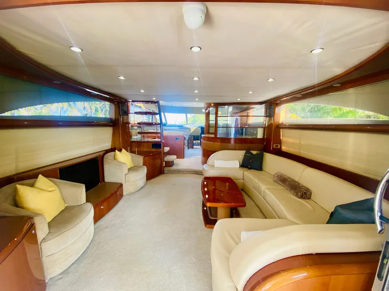 Slide: The Image of Luxurious interior of a 2006 Viking Sport Cruisers 70 Motor Yacht with plush seating and elegant wood finishes. - 28
