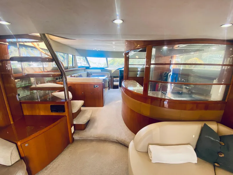 Slide: The Image of Luxurious interior of a 2006 Viking Sport Cruisers 70 Motor Yacht with elegant wood finishes. - 33