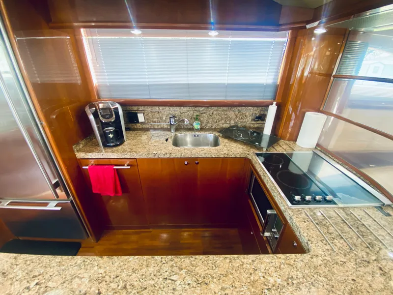 Slide: The Image of 2006 Viking Sport Cruisers 70 Motor Yacht kitchen with granite countertops and modern appliances. - 38