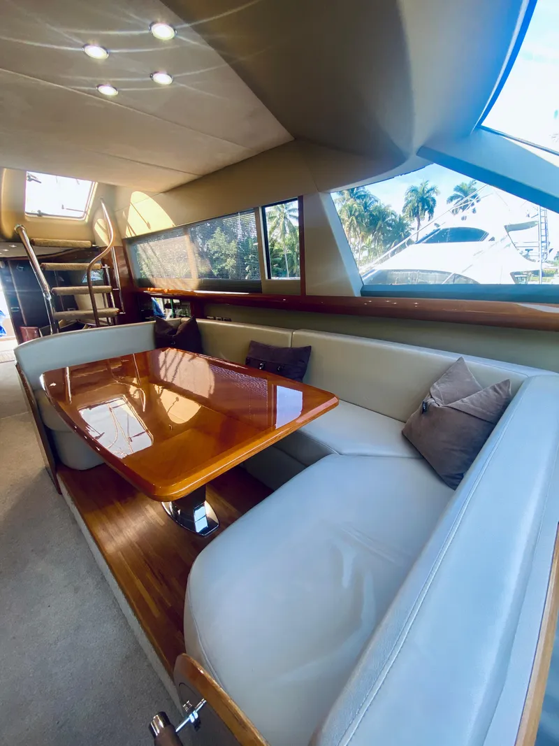 Slide: The Image of Interior of 2006 Viking Sport Cruisers 70 Motor Yacht with elegant dining area. - 42