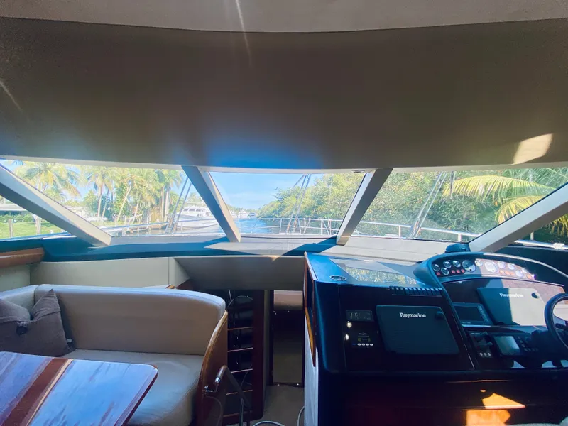 Slide: The Image of Interior helm of 2006 Viking Sport Cruisers 70 Motor Yacht with panoramic view. - 43