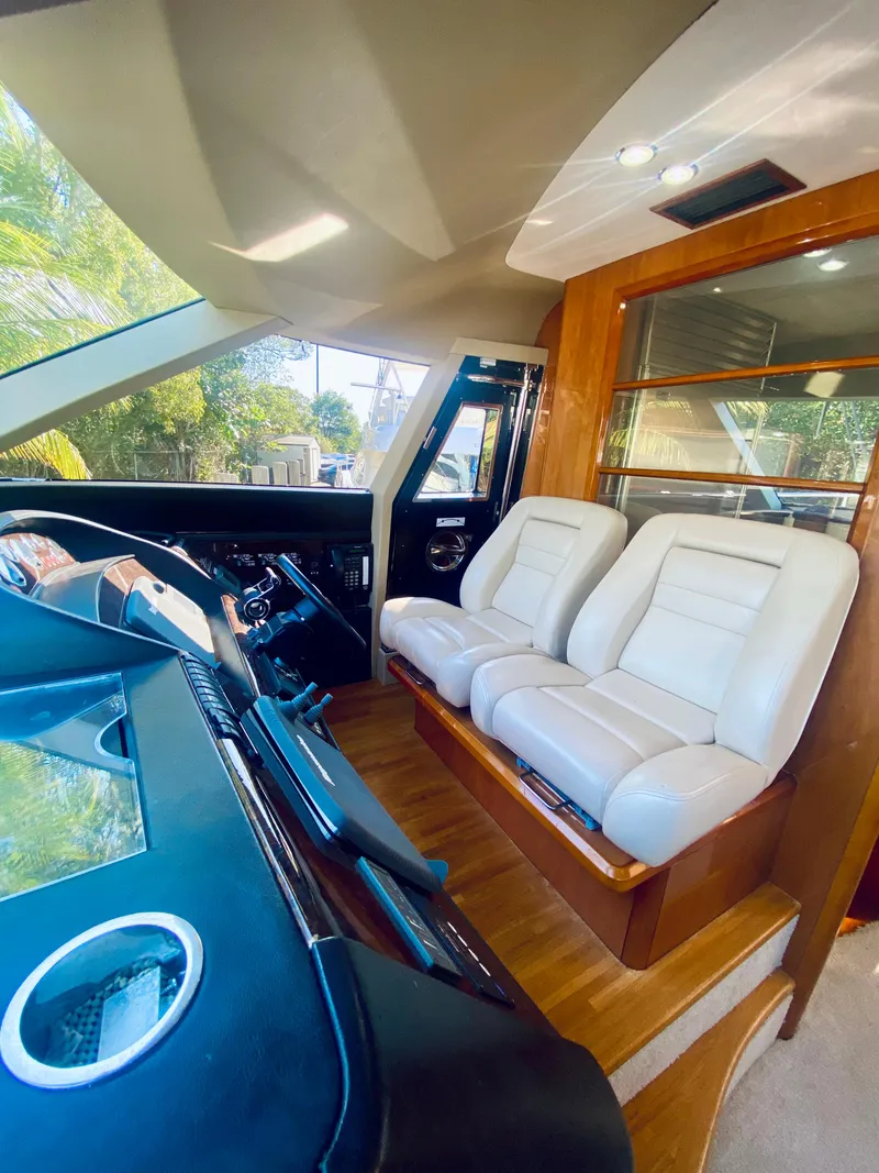 Slide: The Image of Interior of 2006 Viking Sport Cruisers 70 Motor Yacht with white leather seats. - 45