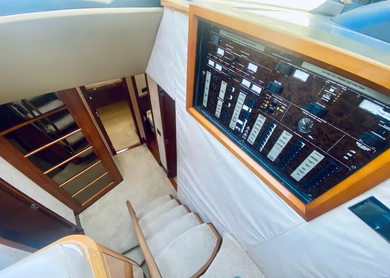 Slide: The Image of Interior of 2006 Viking Sport Cruisers 70 Motor Yacht with control panel and staircase. - 47