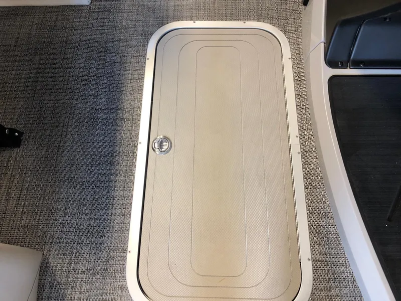 Slide: The Image of Barletta Cabrio 20Q 2024 floor storage compartment with textured lid and secure latch. - 17