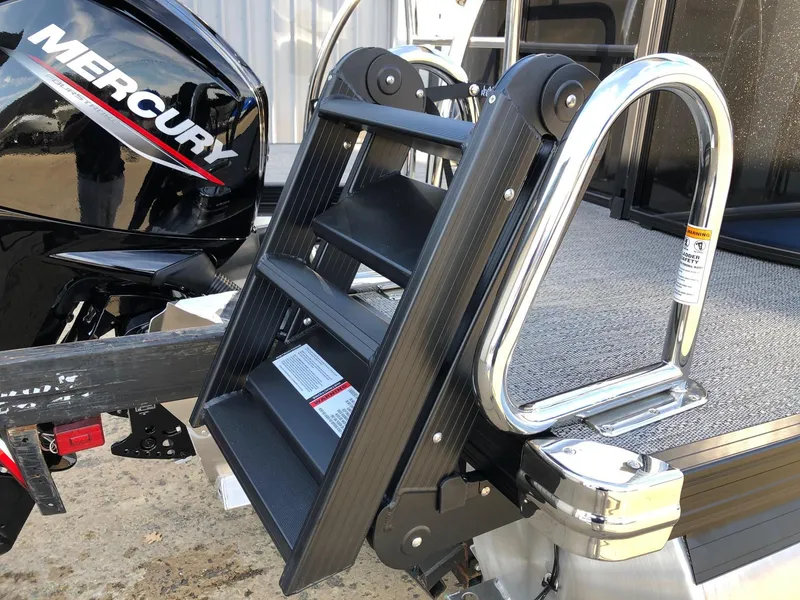 Slide: The Image of 2024 Barletta Cabrio 20Q boat with Mercury engine and foldable ladder. - 5