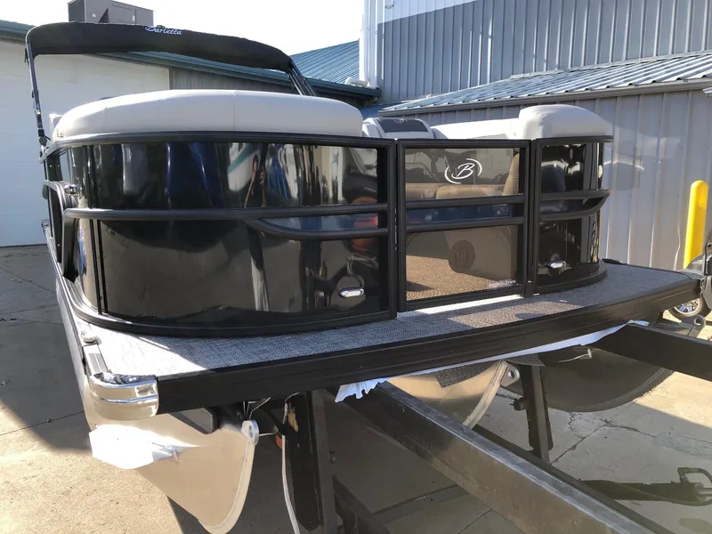 Slide: The Image of 2024 Barletta Cabrio 20Q pontoon boat on a trailer, front view. - 6