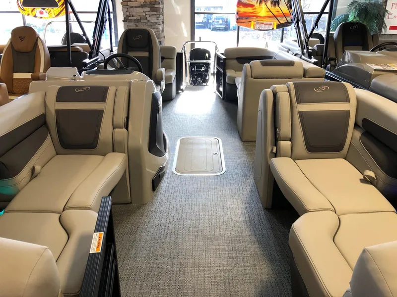 Slide: The Image of 2024 Barletta Cabrio 20Q pontoon boat interior with luxurious seating and modern design. - 7
