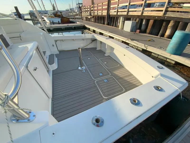 Slide: The Image of 2005 Viking 45 Open Express boat deck at marina. - 10