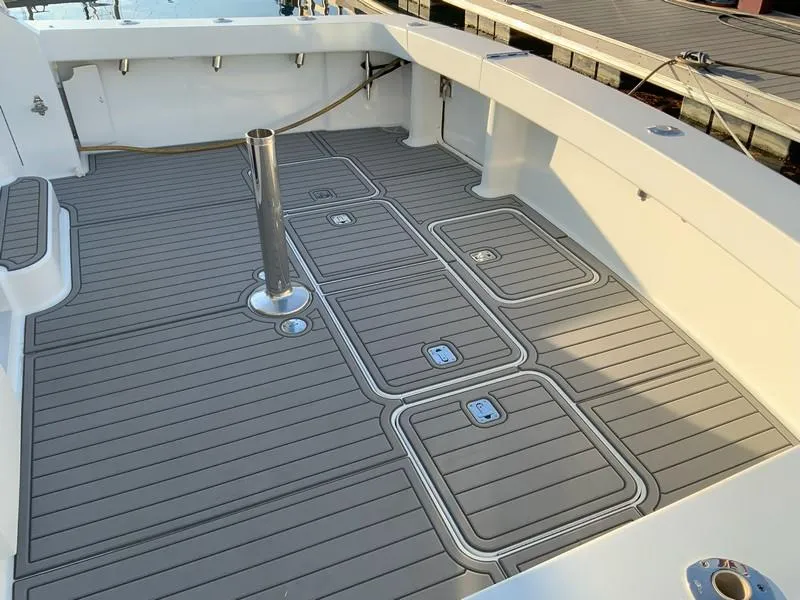 Slide: The Image of 2005 Viking 45 Open Express boat deck with storage compartments. - 11