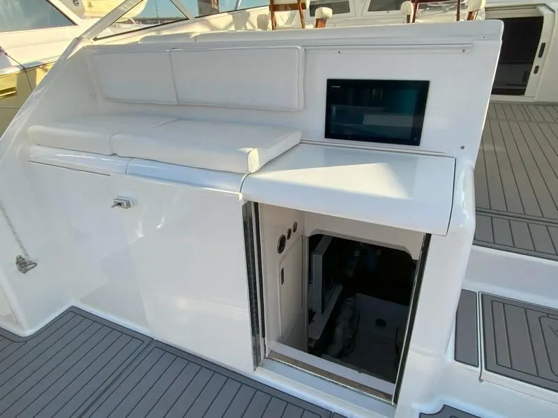 Slide: The Image of 2005 Viking 45 Open Express boat interior with seating and storage. - 13